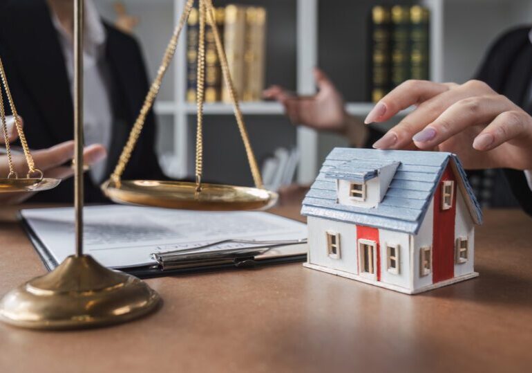 Real estate businessman consults a lawyer against the law relating to houses, land and real estate.